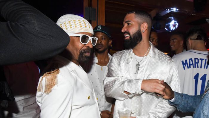 Drake Laughs At His Dad’s Tattoo Of Him And The Artist Isn’t Pleased